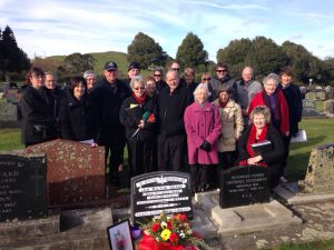 Family of James Lewis George Grant gather at his headstone where his ashes were laid to rest at his father’s plot in Taranaki on July 9. Supplied