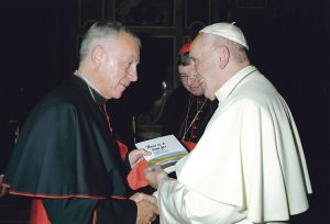 Cardinal John presents Pope Francis with the first copy of ‘There’s a Time For… a new book of family prayers being launched in Wellington in December.
