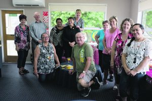 Staff with Fr Arthur Toothill, second left, and principal Leonie McEwan, third left.