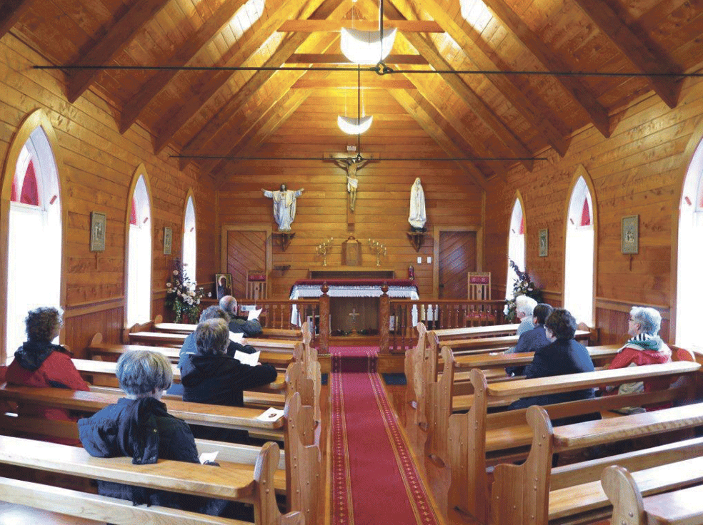 Some of the retreat group praying in the church at Motuti, interment place of Bishop Pompallier. Photo: Michael Mahoney SM.