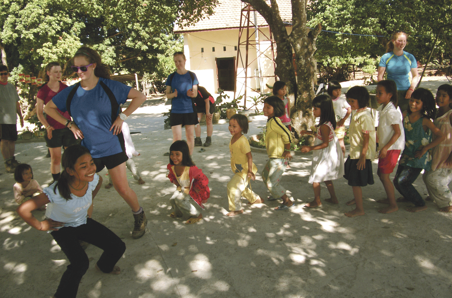 The team dancing and playing games with the children of an orphanage in Kon Tum. Photo: Mike Cotsilinis