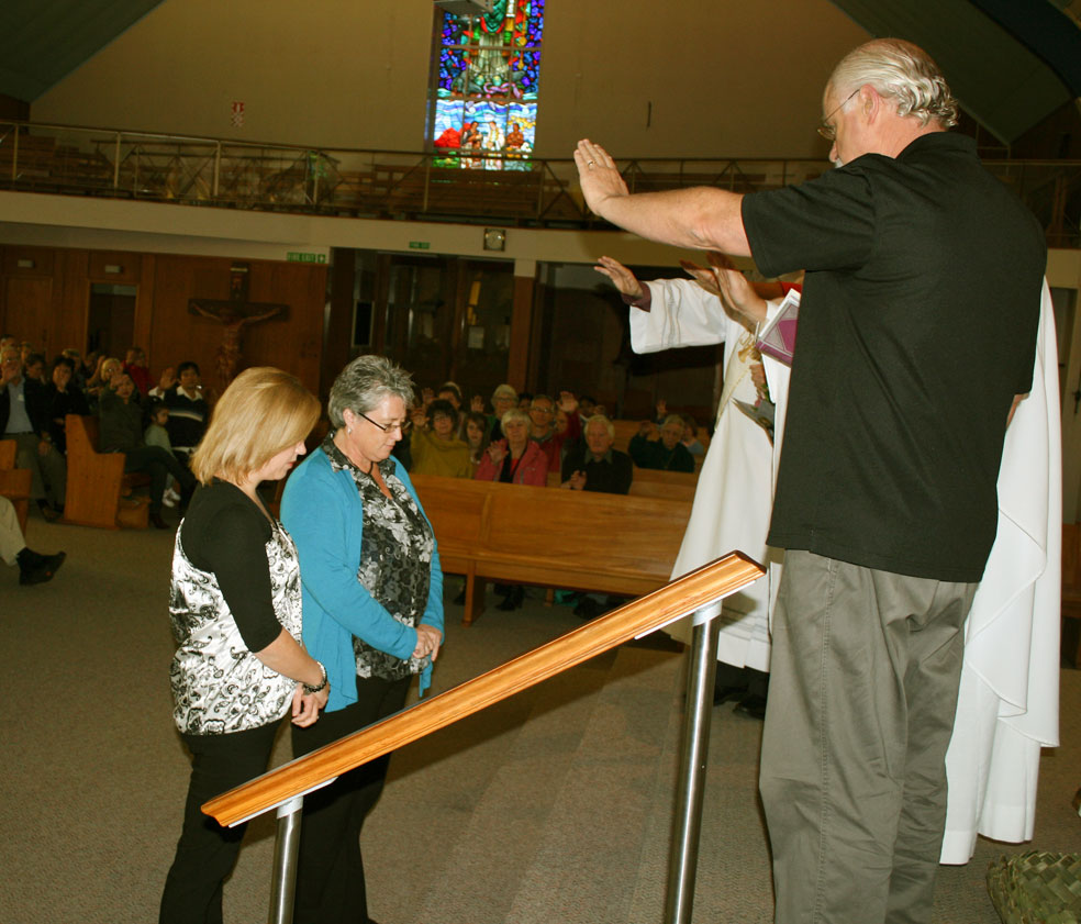 Joe Green, Fr Michael McCabe and Deacon Doug Shepherd bless new youth ministers Delwyn Barber and Jacqui McLaughlin.