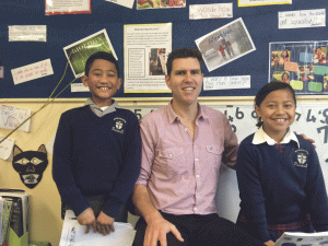 Mr Theobold with Holy Family School students Vincent Patelesio-Galuo’Meli, and TiaLei Pita Lakopo Simiti.