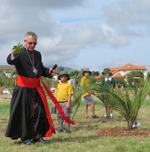 Cardinal John Dew blesses new building site for Our Lady of Kapiti parish and school as St Patrick’s school children watch. Photo: Kapiti Observer