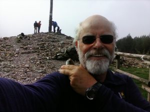 Joe Green at the Cruz Ferro where pilgrims leave a rock from home.