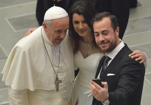 Amoris Laetitia upholds Church teaching on marriage and family. Pope Francis with newlyweds during a general audience at the Vatican.  Photo: OneShot/Corbis/ETTORE FERRARI