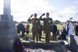 Reservist chaplains Fr Richard Laurenson and Fr Tony Harrison showing respect after laying poppies to a fallen soldier, Fr Patrick Dore, Foxton. Photo: Annette Scullion