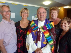 Fr Bill Warwick and parishioners from his previous parish at Plimmerton, with Shirley Kelland on the right, who responded to the welcoming karanga.