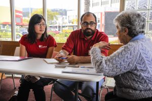 Caritas staff members give advice at the Benefit Impact.  Photo: Caritas