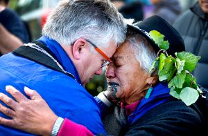 New Plymouth Mayor Andrew Judd is embraced by Parihaka elder Te Whero o te Rangi Bailey.