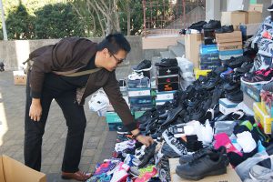 Ignatius Susilo from ICPE Mission at Mt Victoria’s St Gerard’s Monastery, donates a pair of shoes to the Mountain of Mercy.