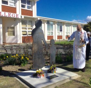 Monsignor John Carde blesses the iron silhouette standing at Chanel College in honour of Masterton’s CWL pioneers