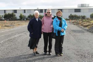 Paraparaumu’s Presentation Sisters Regina Daly, Fran Nicolle and Breda Ryan on the new road, ‘Presentation Way’, at site open day in June.